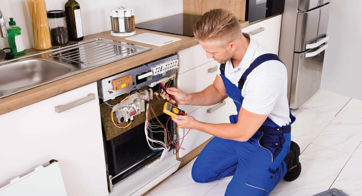 Appliance repair professional servicing a residential washing machine